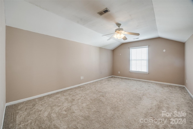 additional living space featuring carpet flooring, ceiling fan, and vaulted ceiling