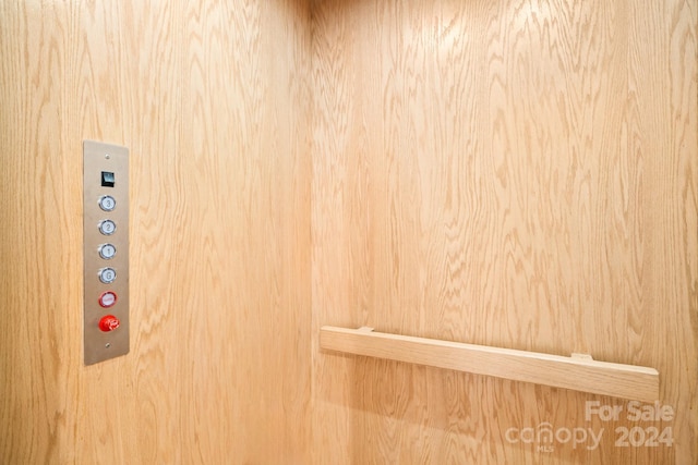 interior details featuring wooden walls and elevator