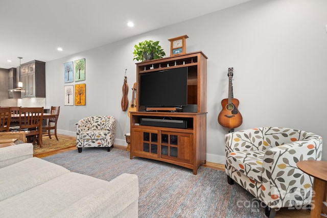 living room with recessed lighting and baseboards