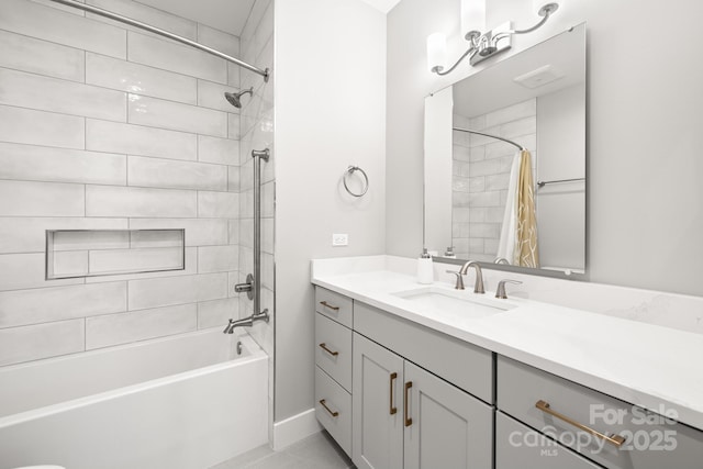 bathroom with vanity, baseboards, and shower / tub combo