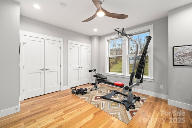exercise room with recessed lighting, baseboards, ceiling fan, and wood finished floors