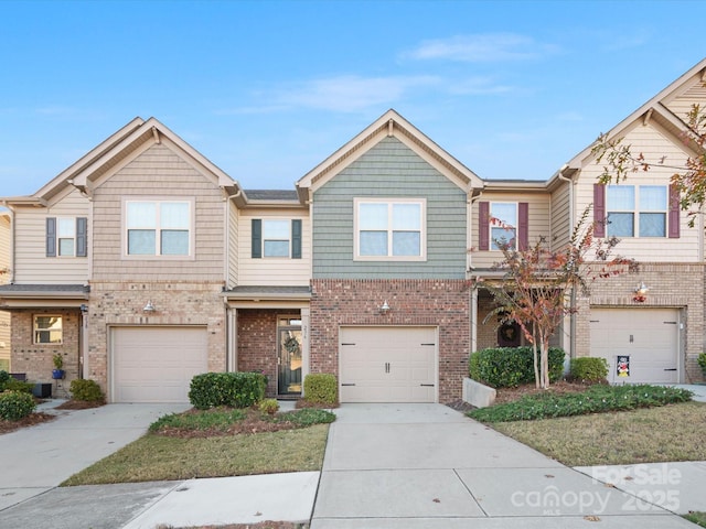 townhome / multi-family property featuring a garage