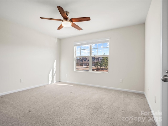 unfurnished room with ceiling fan and light colored carpet