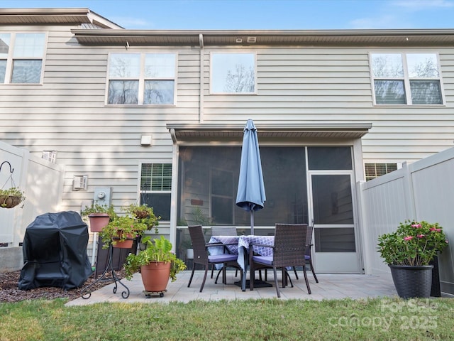 back of house with a patio area and a sunroom