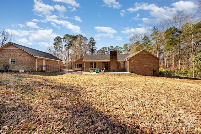 rear view of property with a patio