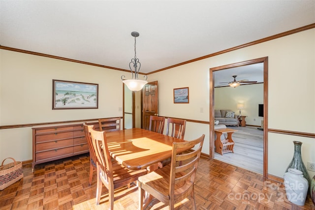 dining area featuring ceiling fan, parquet floors, and ornamental molding