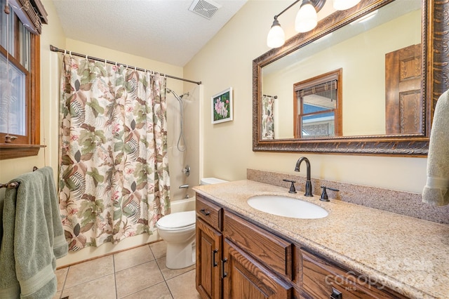 full bathroom with shower / bath combo, tile patterned floors, vanity, a textured ceiling, and toilet