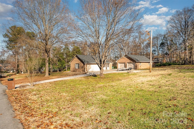 view of yard featuring an outbuilding and a garage