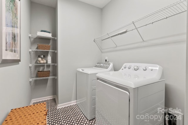 laundry area with washing machine and dryer