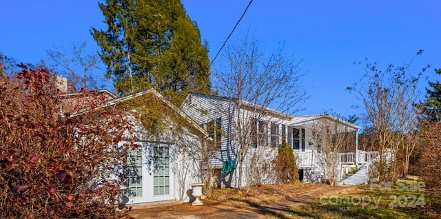 view of property exterior featuring a porch