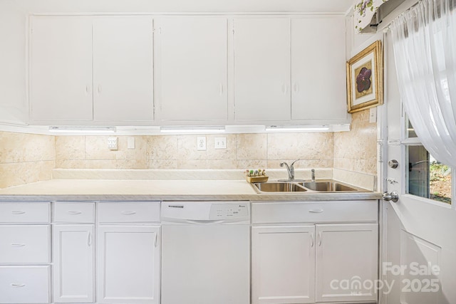 kitchen with white dishwasher, sink, white cabinetry, and decorative backsplash