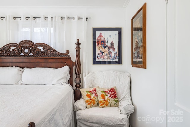 bedroom with crown molding