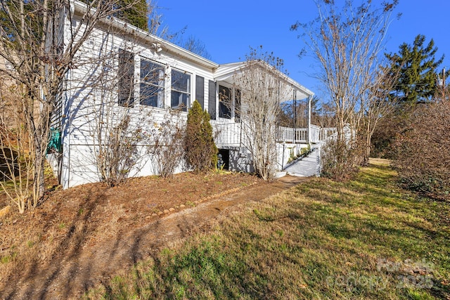 view of home's exterior featuring a lawn