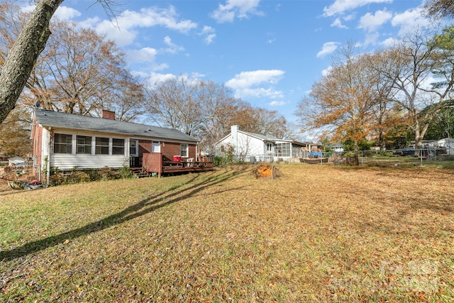 view of yard with a wooden deck