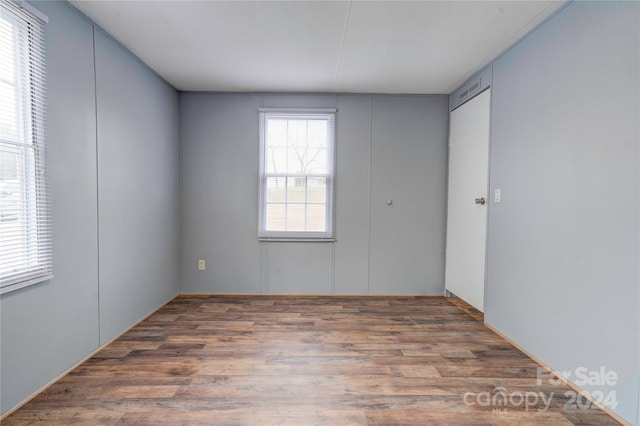 unfurnished room featuring hardwood / wood-style floors