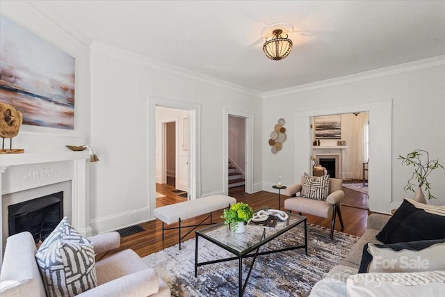 507 W 2nd Ave, Gastonia, NC 28052 - living area featuring a fireplace, ornamental molding, wood finished floors, stairway, and baseboards