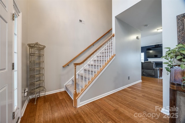 staircase featuring hardwood / wood-style flooring