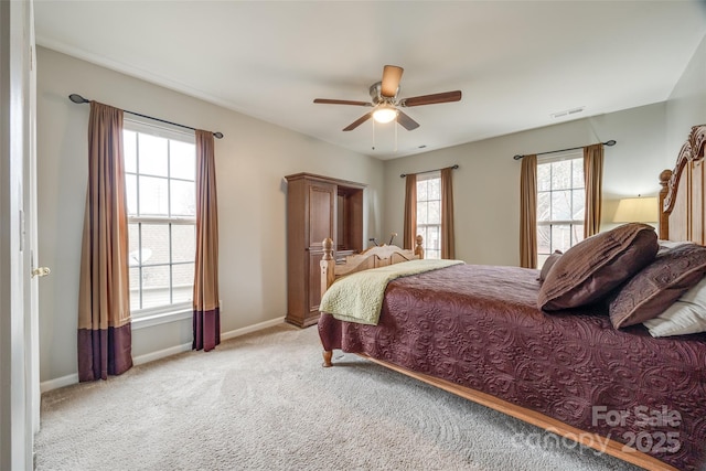 bedroom with ceiling fan and light carpet