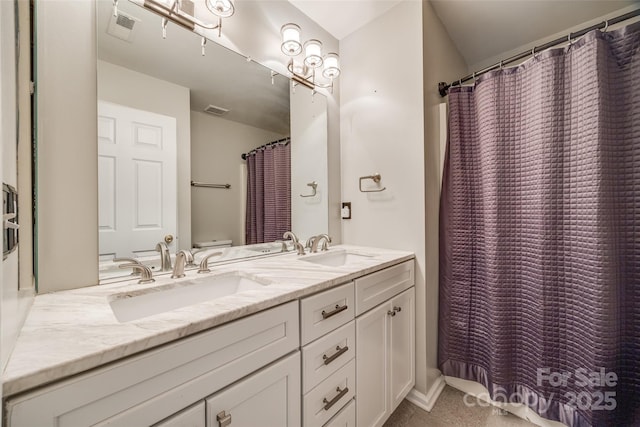 bathroom featuring a shower with shower curtain, vanity, and toilet