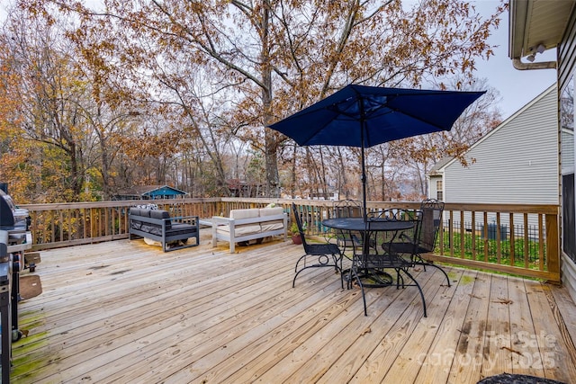 wooden terrace featuring an outdoor living space