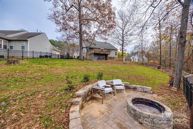 view of yard featuring a patio area and a fire pit