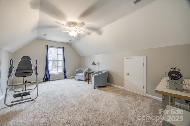 exercise area featuring lofted ceiling, light colored carpet, and ceiling fan