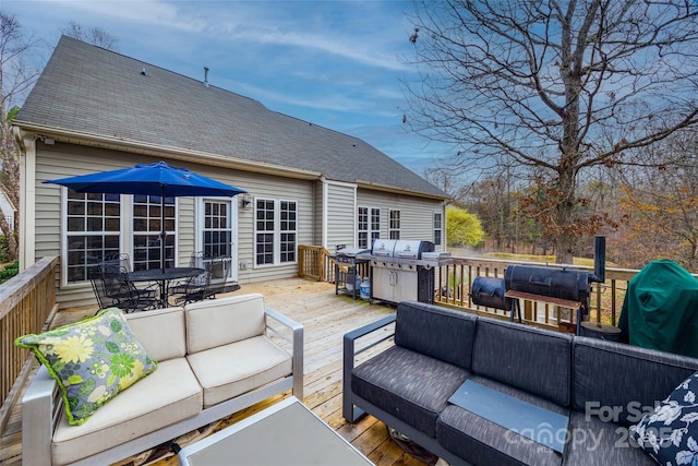 wooden terrace featuring grilling area and outdoor lounge area