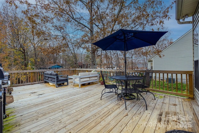 wooden deck with outdoor lounge area