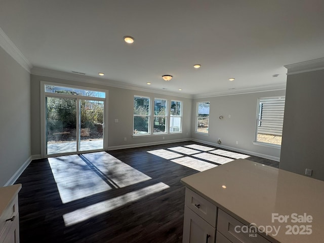 unfurnished living room featuring dark wood-type flooring and ornamental molding