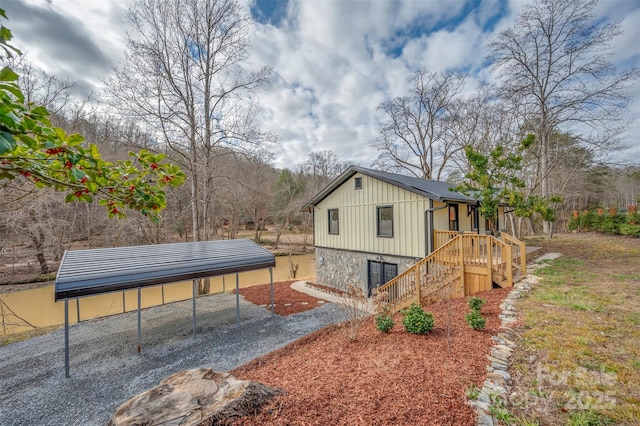 view of home's exterior with a carport