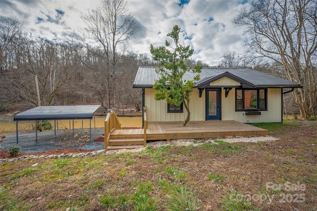 exterior space with a carport and a deck