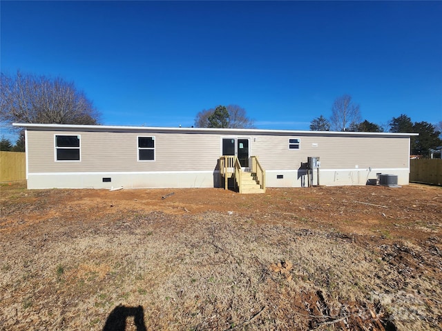 back of house featuring cooling unit