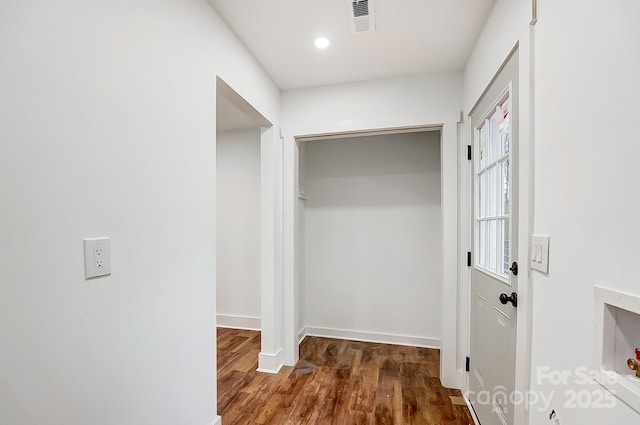 corridor with dark wood-type flooring