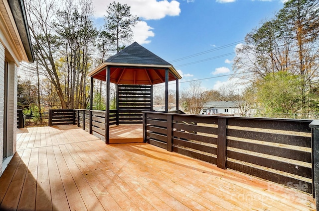 wooden deck featuring a gazebo