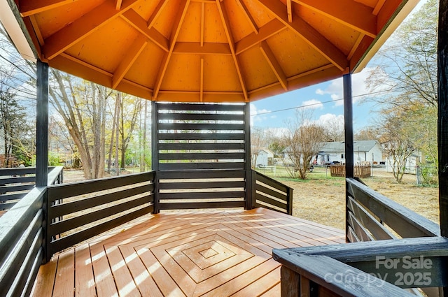 wooden terrace with a gazebo