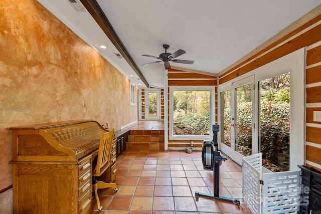 unfurnished sunroom featuring lofted ceiling and ceiling fan