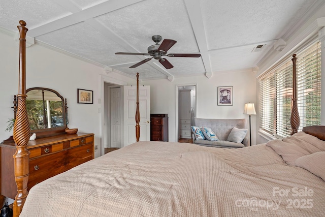 bedroom with coffered ceiling, multiple windows, and ceiling fan