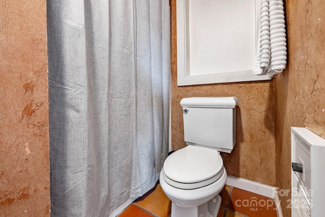 bathroom featuring tile patterned flooring and toilet