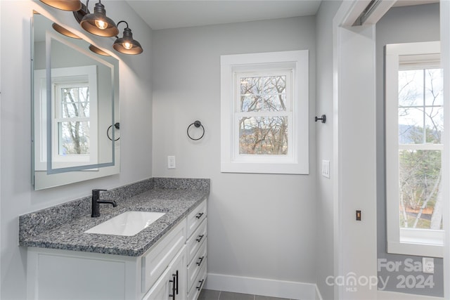 bathroom with tile patterned floors and vanity