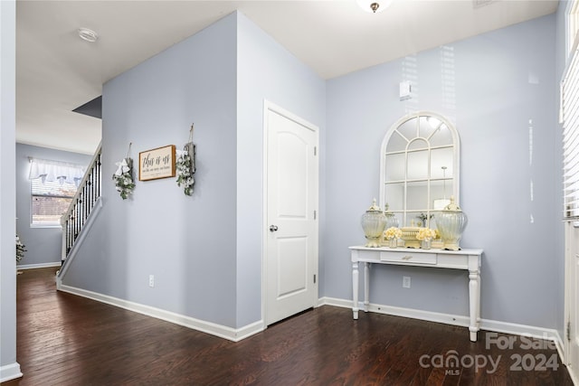 hall with hardwood / wood-style flooring