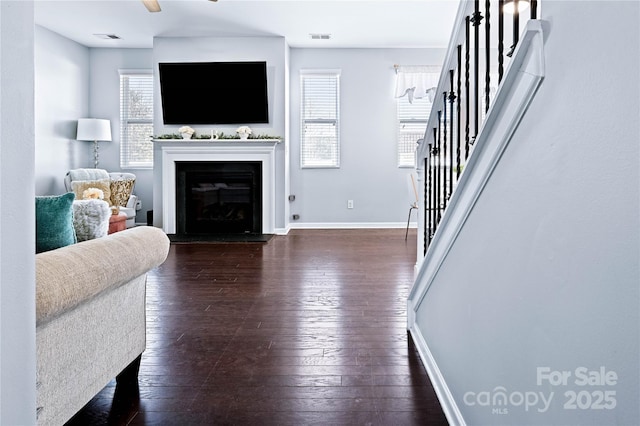 living room with dark hardwood / wood-style floors