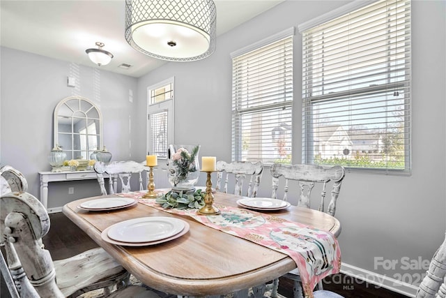 dining area with hardwood / wood-style floors