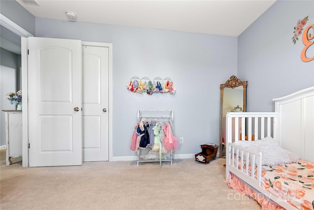 carpeted bedroom with a closet