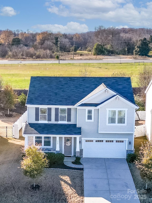 view of front of home featuring a garage and a front lawn