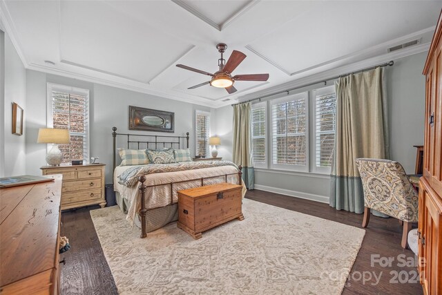 bedroom featuring ceiling fan, dark wood-type flooring, crown molding, and coffered ceiling