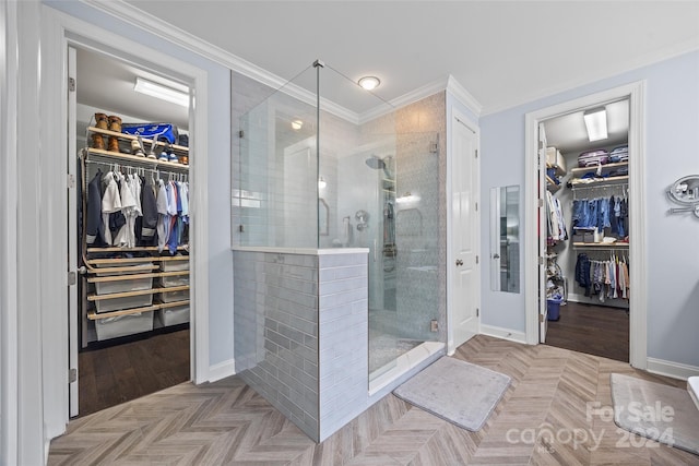 bathroom featuring crown molding, an enclosed shower, and parquet flooring