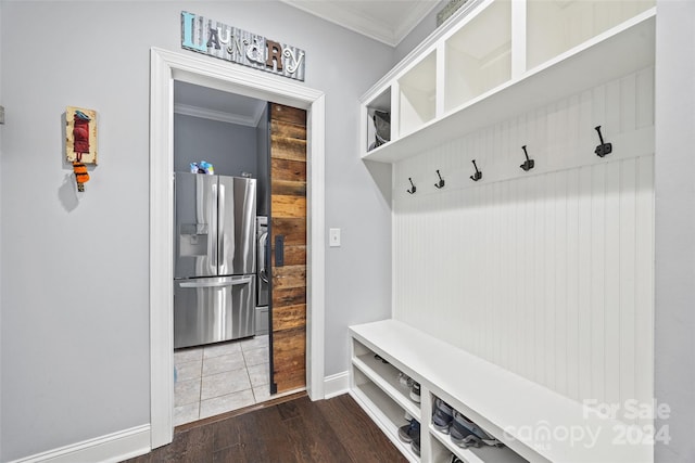 mudroom with dark wood-type flooring and ornamental molding