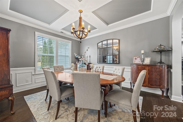 dining space with coffered ceiling, dark hardwood / wood-style floors, crown molding, and an inviting chandelier