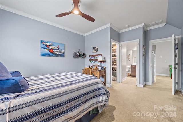 bedroom featuring ensuite bathroom, light colored carpet, ceiling fan, crown molding, and a closet