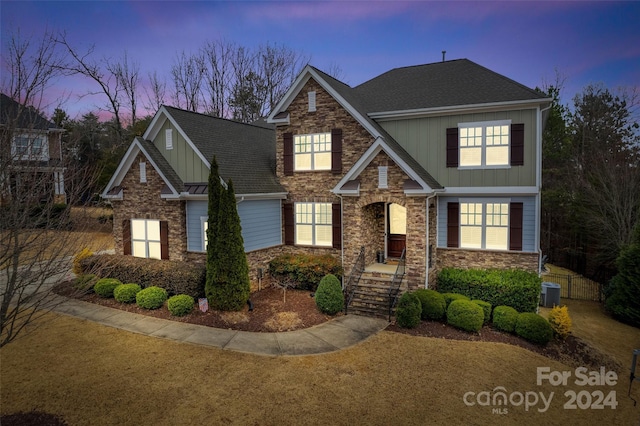 craftsman-style house with central AC unit